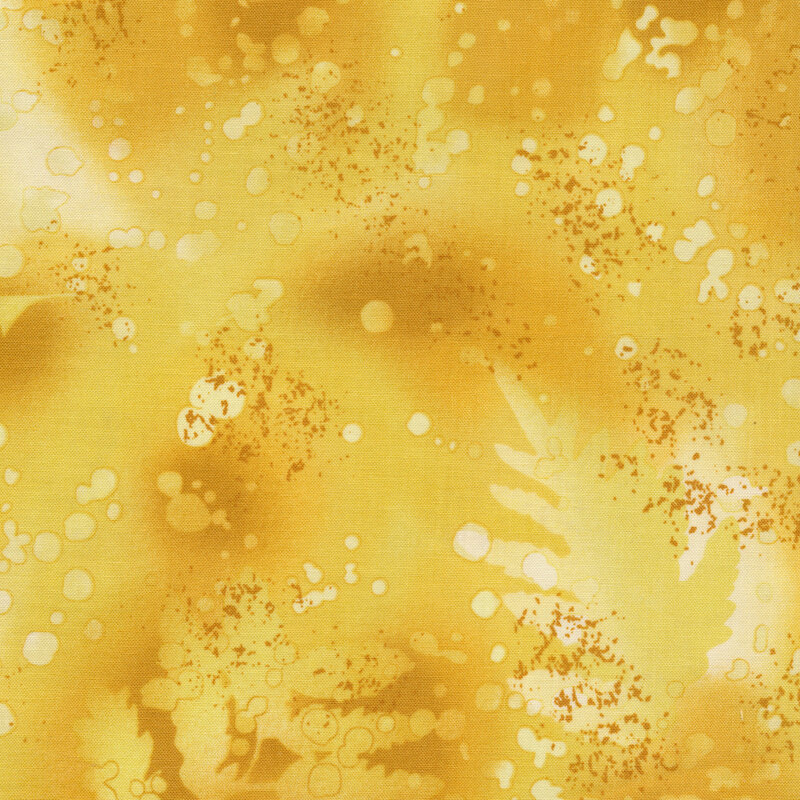 variegated golden yellow fabric with light splatters and mottling