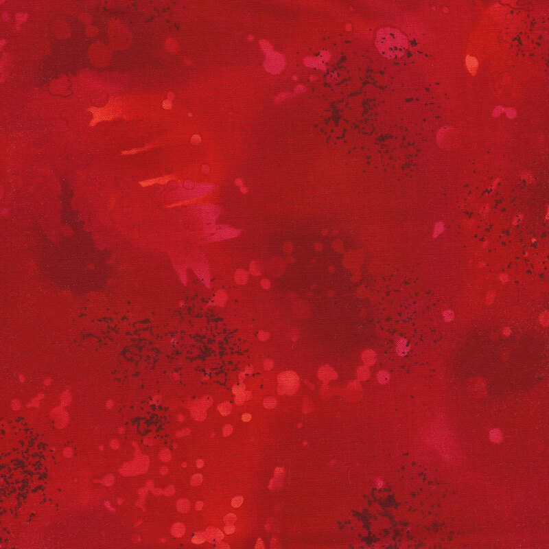 variegated red fabric with light splatters and mottling