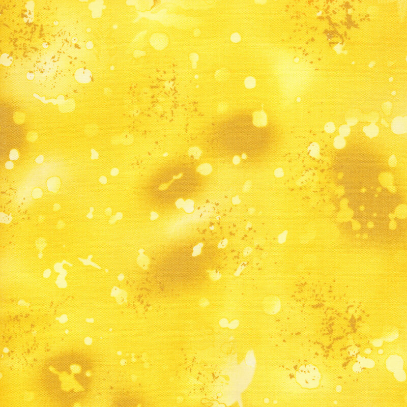 variegated yellow fabric with light splatters and mottling