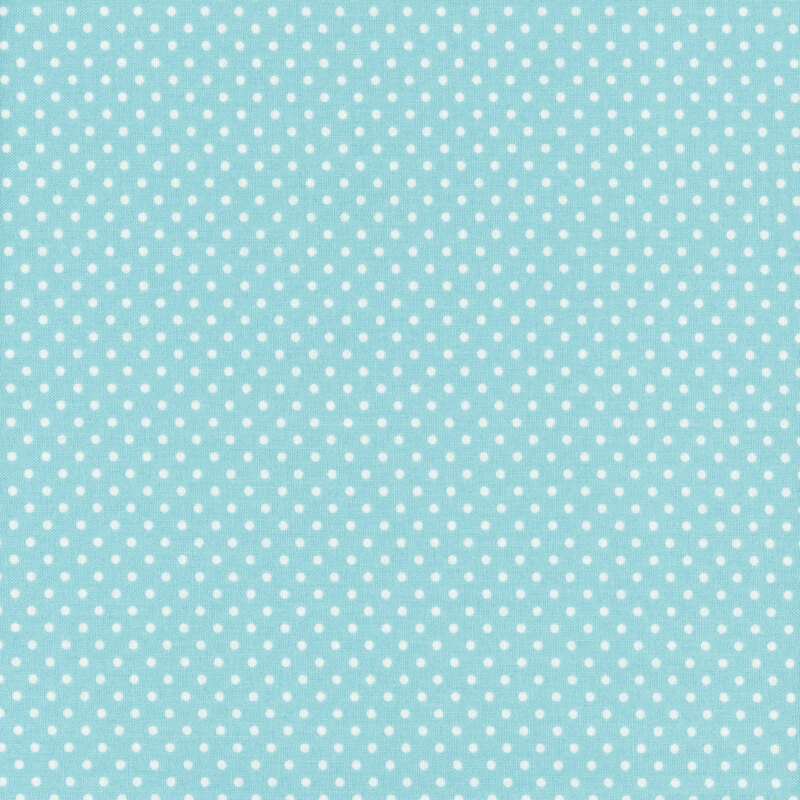 this fabric features a lovely bright sky blue background with ditsy white polka dots