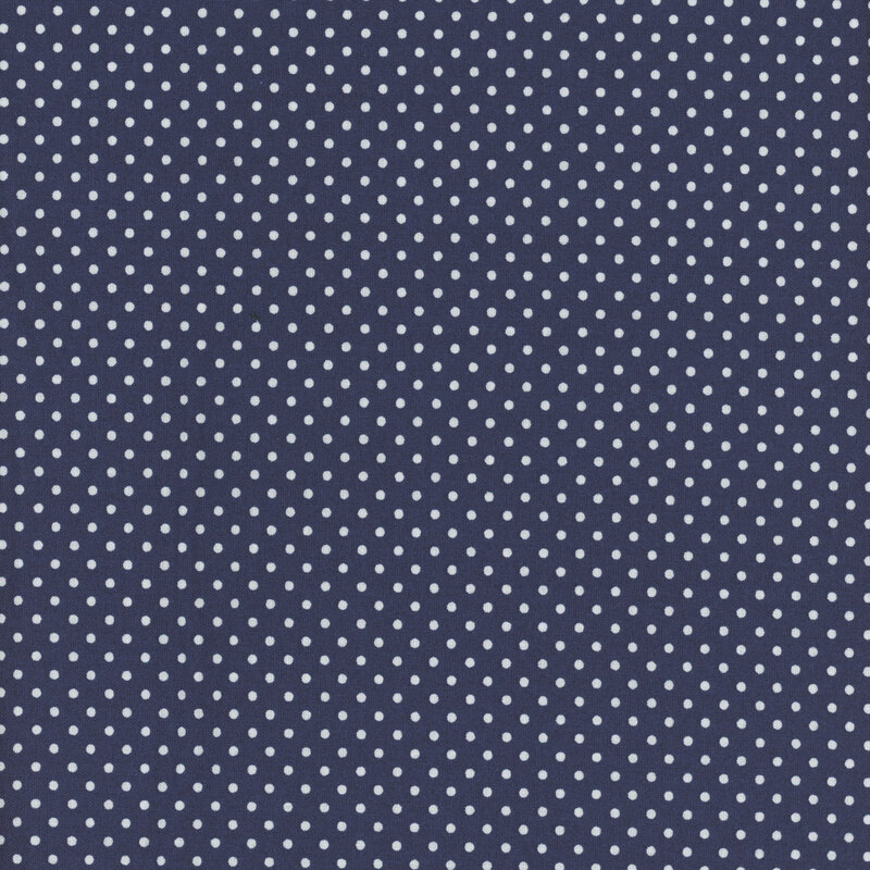 this fabric features dark blue fabric with ditsy white polka dots