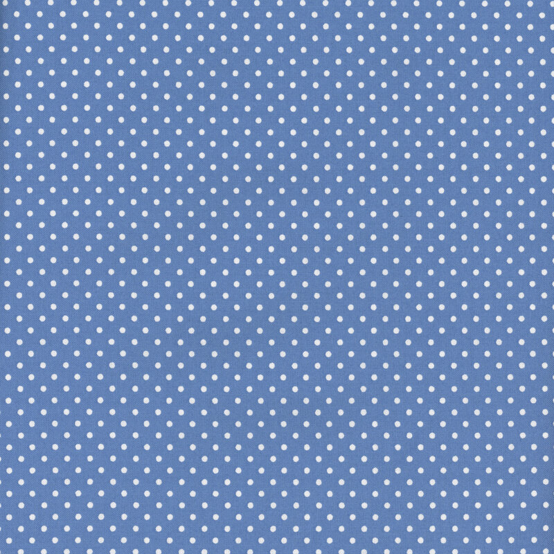 This fabric features a medium dark blue basic fabric with white ditsy polka dots