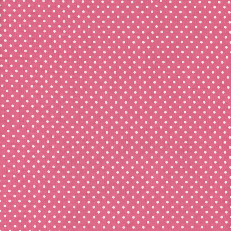 this fabric features a lovely bright bubblegum pink background with ditsy white polka dots