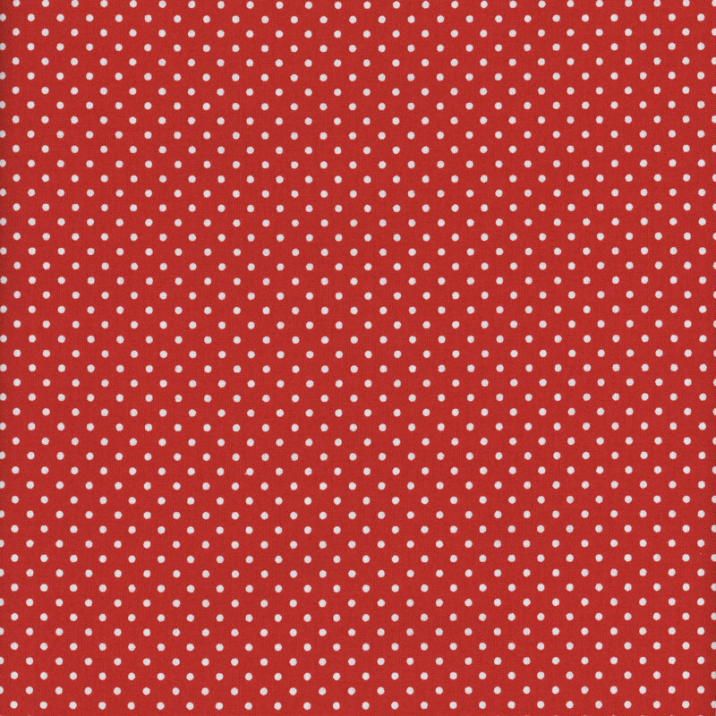 this fabric features cherry red background with white ditsy polka dots
