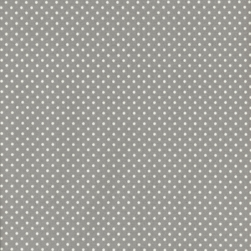 This fabric features a dark steel grey background with ditsy white polka dots