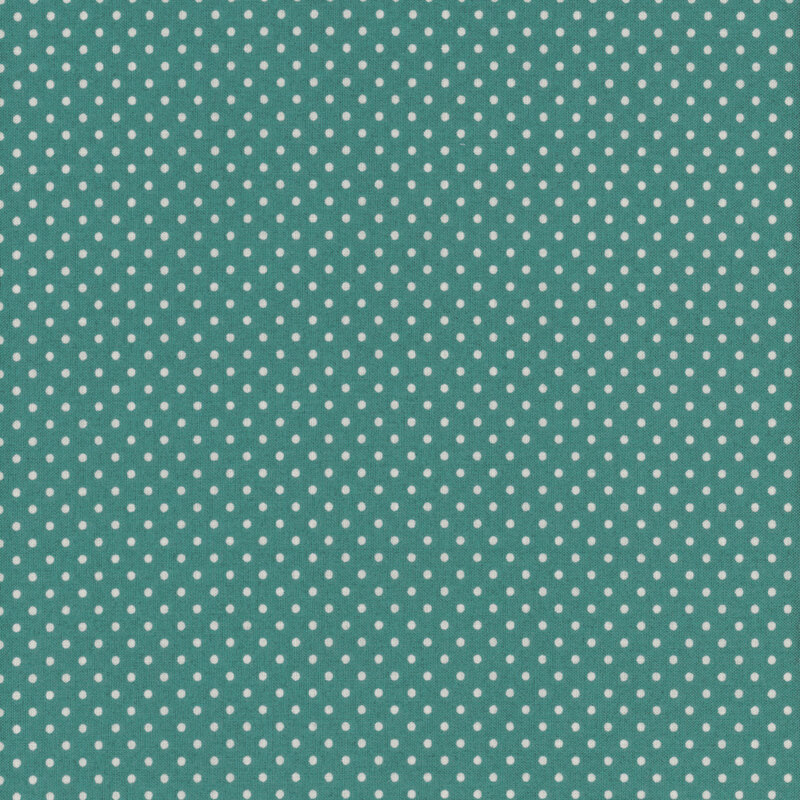 this fabric features a lovely dark green teal with a white ditsy polka dots