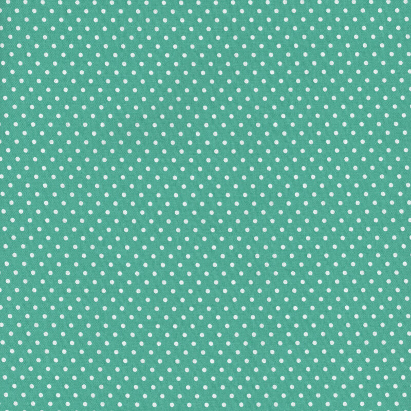 dark turquoise fabric with white polka dots