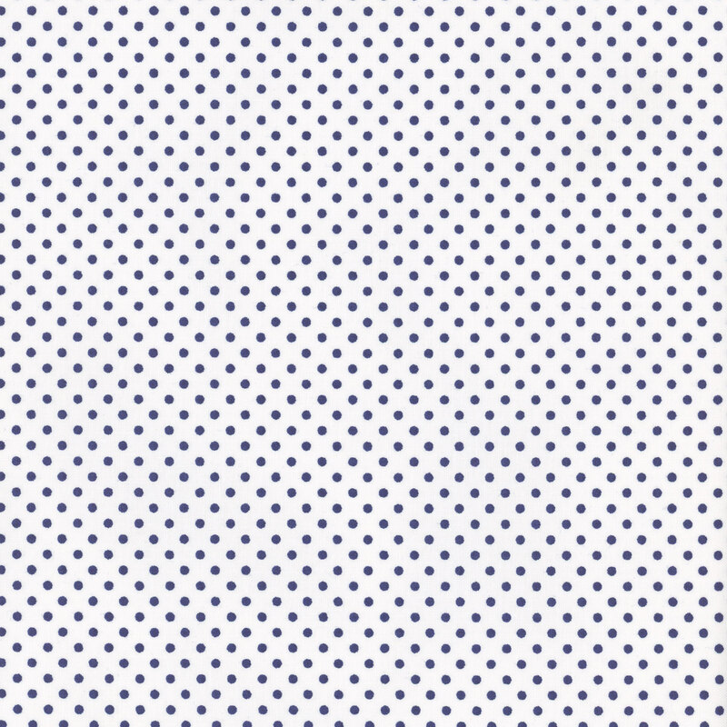 this fabric features a stark white background with dark blue polka dots