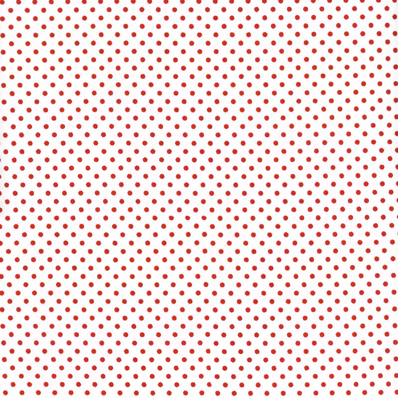 this fabric features a stark white background with bold red polka dots 