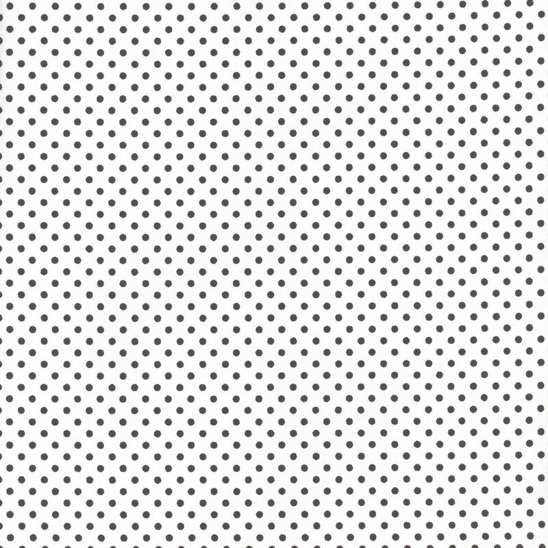 this fabric features a stark white background with solid black polka dots
