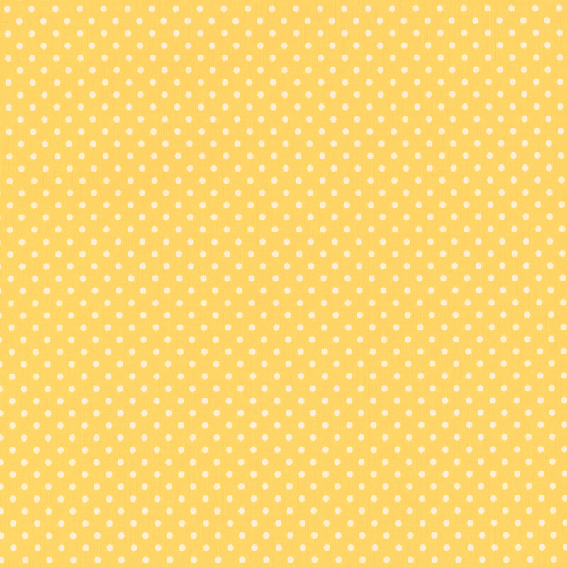 this fabric features a bright sunshine yellow with white ditsy polka dots