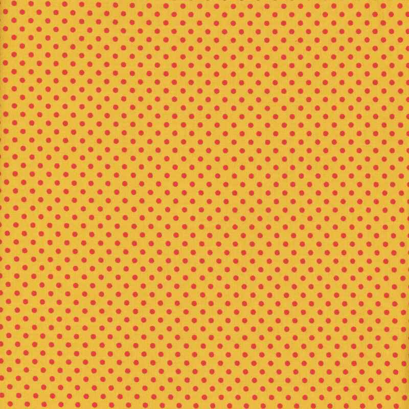 this fabric features a lovely golden yellow with bright orange polka dots