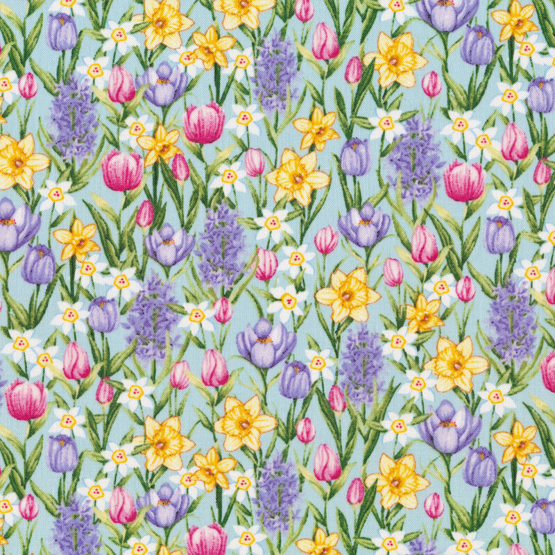 fabric with pink and purple tulips, lilac, and yellow daffodils on a light pastel blue background