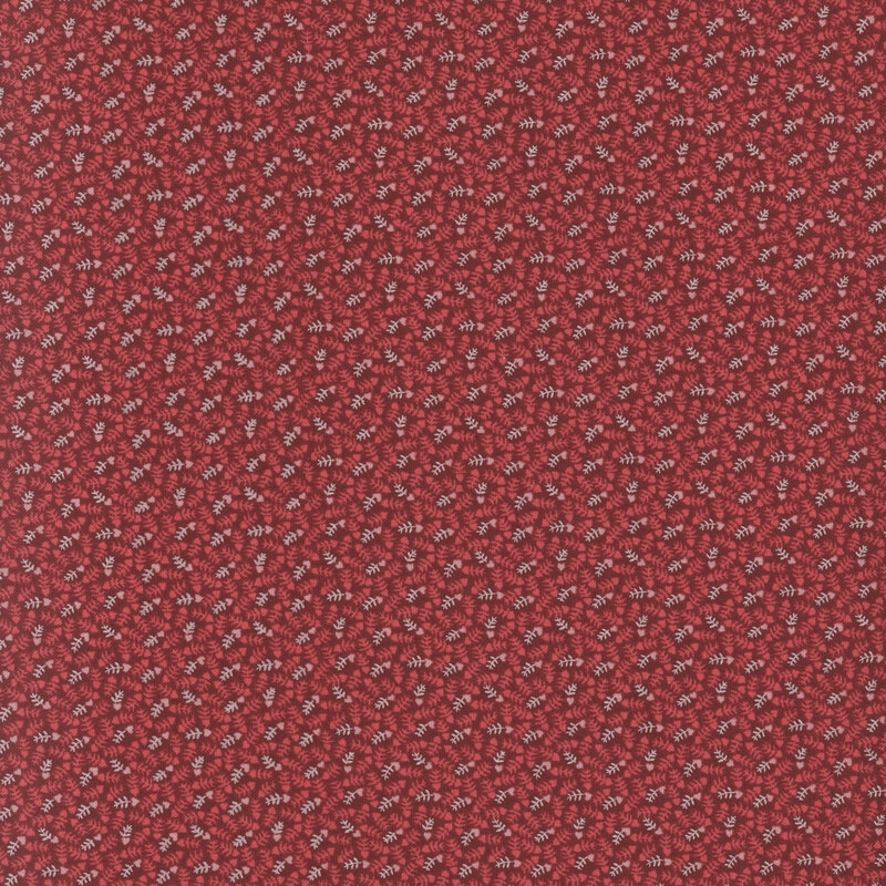 fabric featuring pink and white vines with hearts on a dark red background
