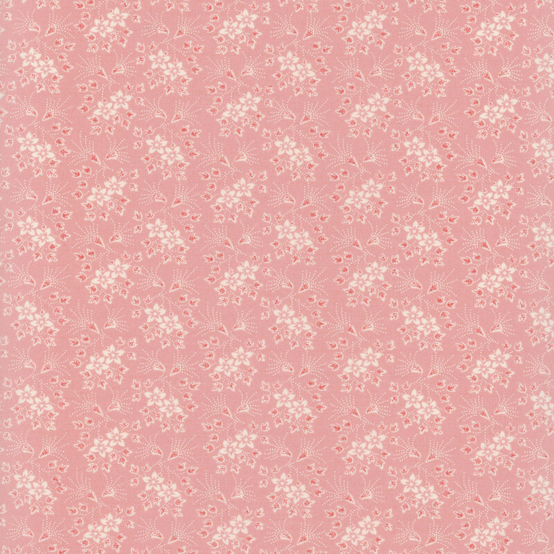 fabric featuring white florals and vines on a light pink background