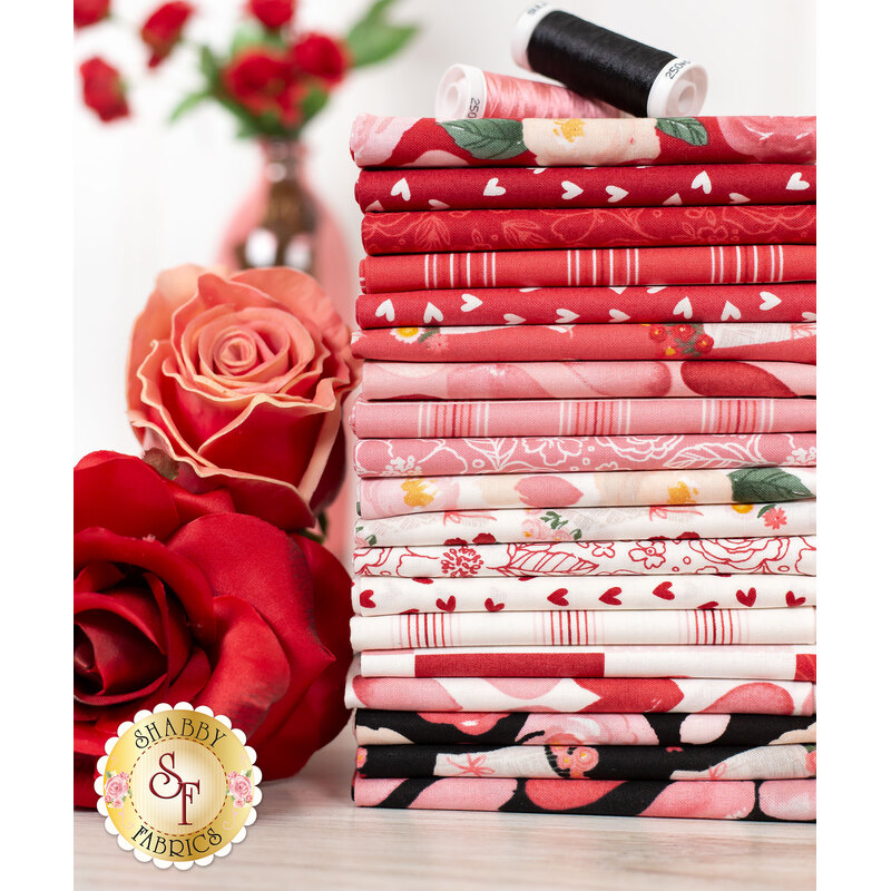 pink red and black fabric with roses and hearts