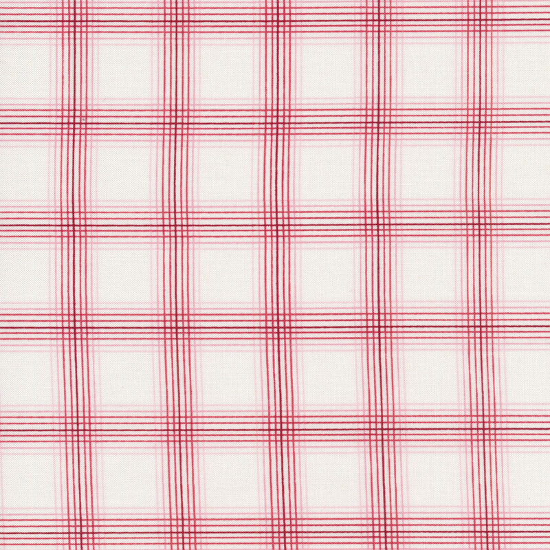 This fabric features a lovely thin-lined red plaid print on a white background