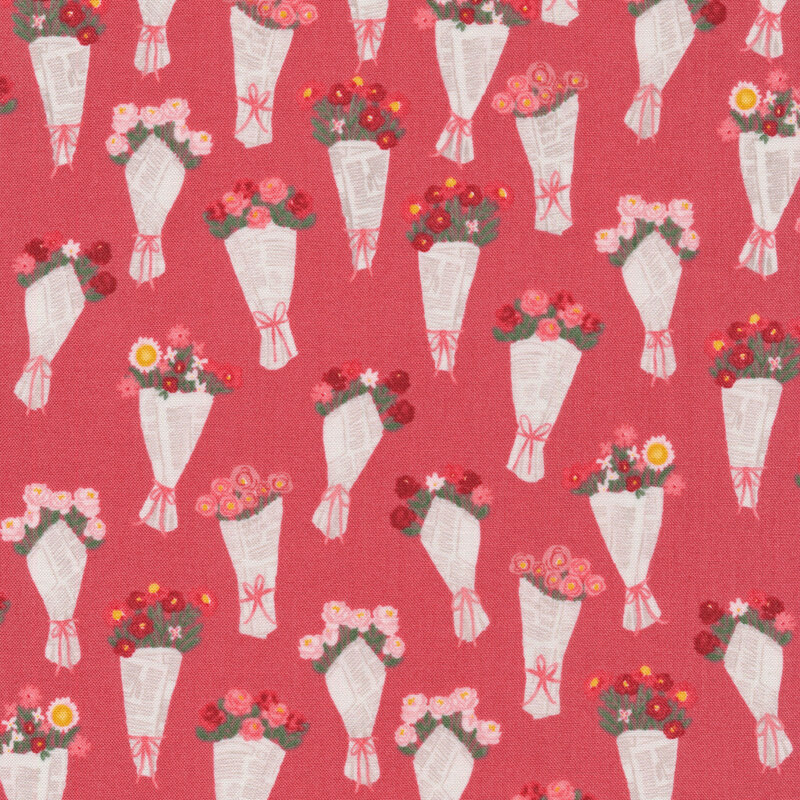fabric featuring adorable bouquets of pink and red flowers wrapped in newspaper on a coral pink background