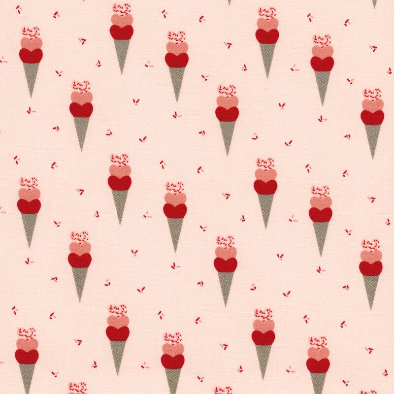 fabric that features ice cream cones with hearts on a light pink background