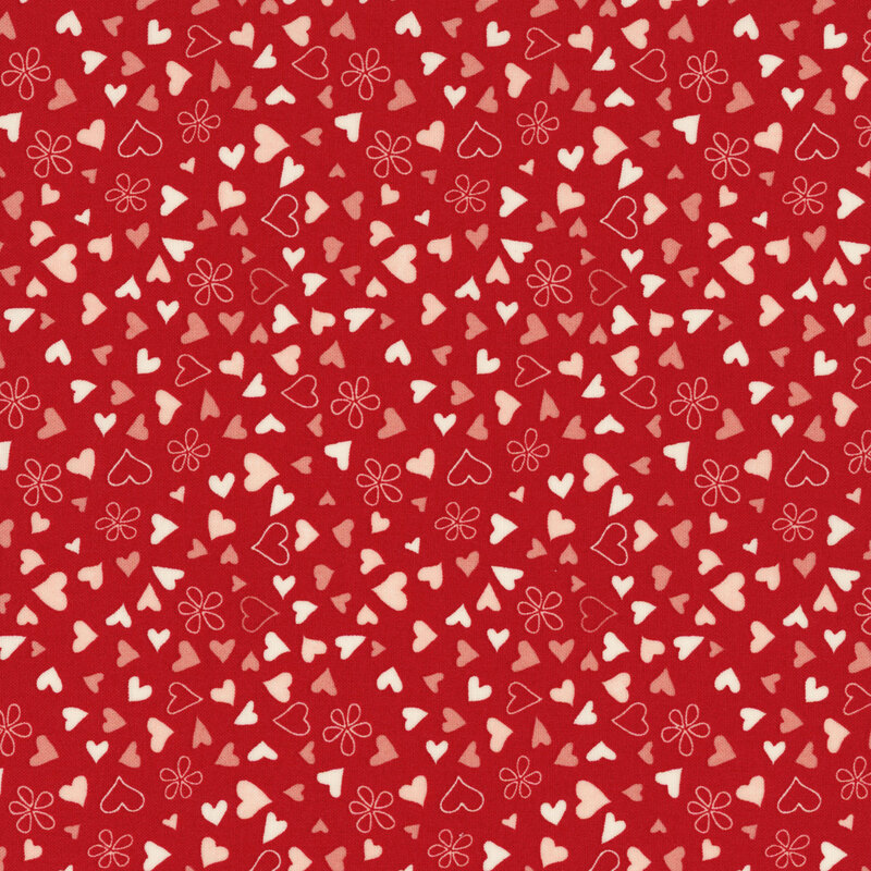 fabric featuring ditsy tossed fabric featuring ditsy tossed pink, tan, and cream hearts on a solid red background