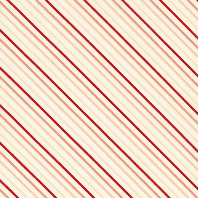 fabric featuring a cream background with red and tonal pink diagonal stripes