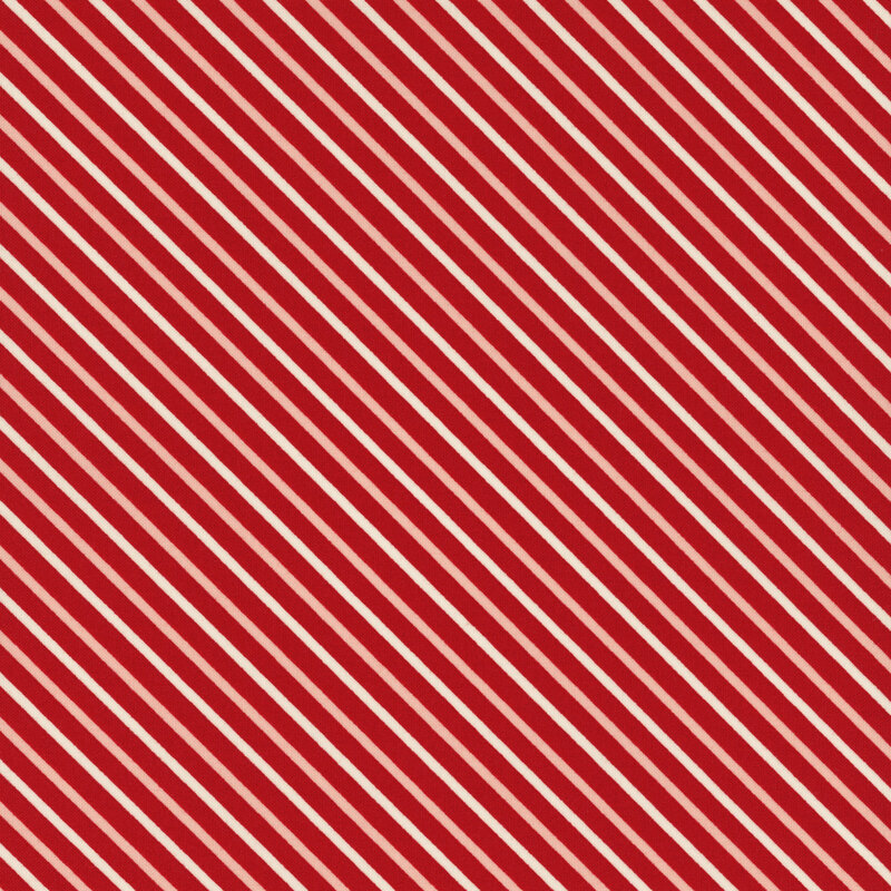 fabric featuring a red background with cream and pink diagonal stripes
