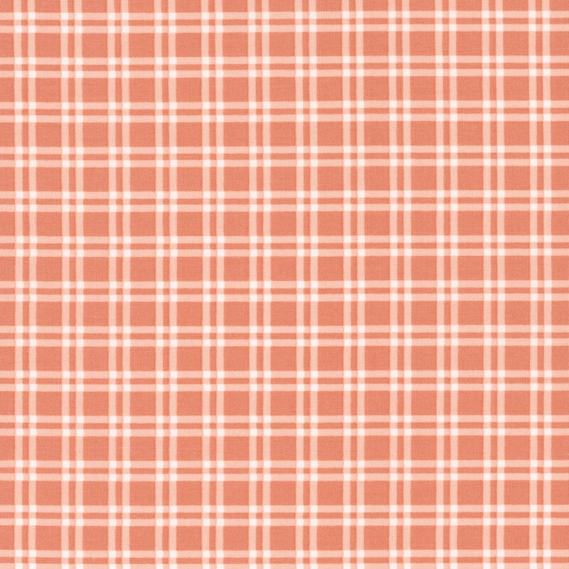 fabric featuring a soft pink and cream colored plaid pattern