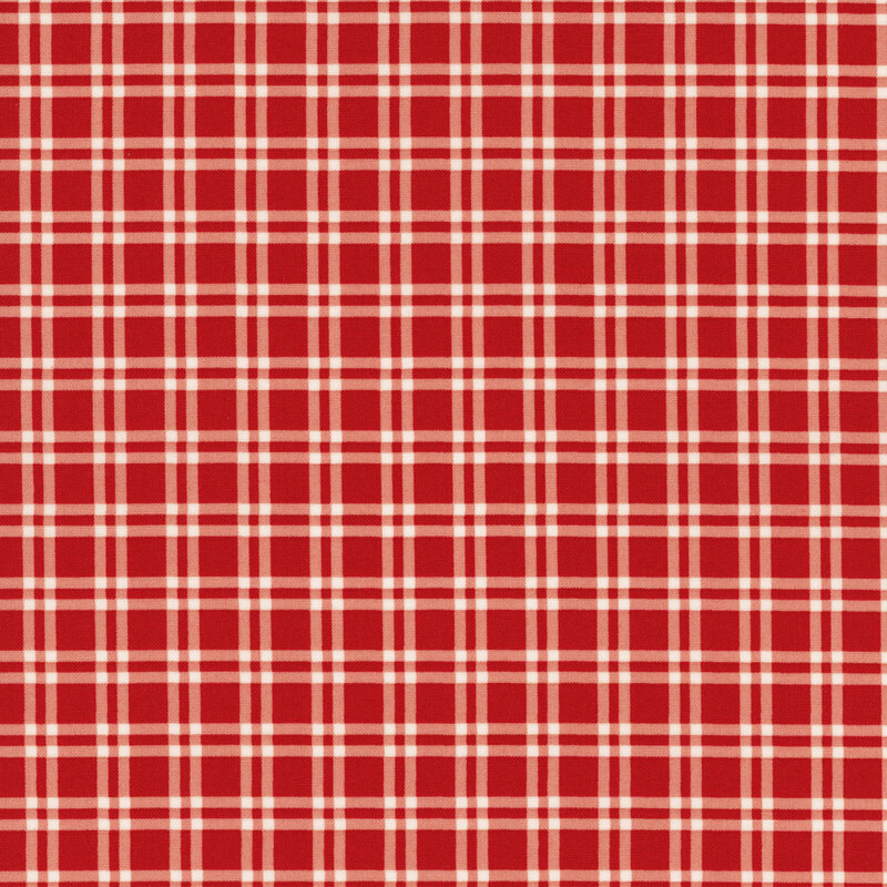 fabric featuring a bold red and cream colored plaid pattern