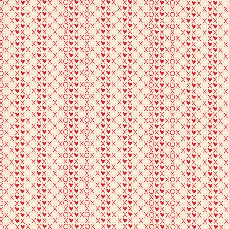 fabric featuring a packed print of XOXO words and hearts in red and pink on a cream background
