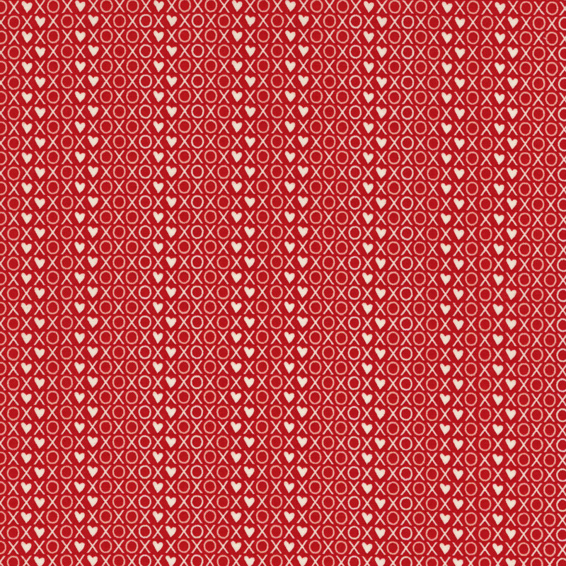 fabric featuring a packed print of XOXO words and hearts in white on a bold red background
