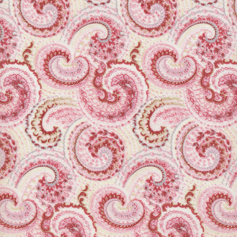 Image of fabric featuring pink and beige paisley on a cream background