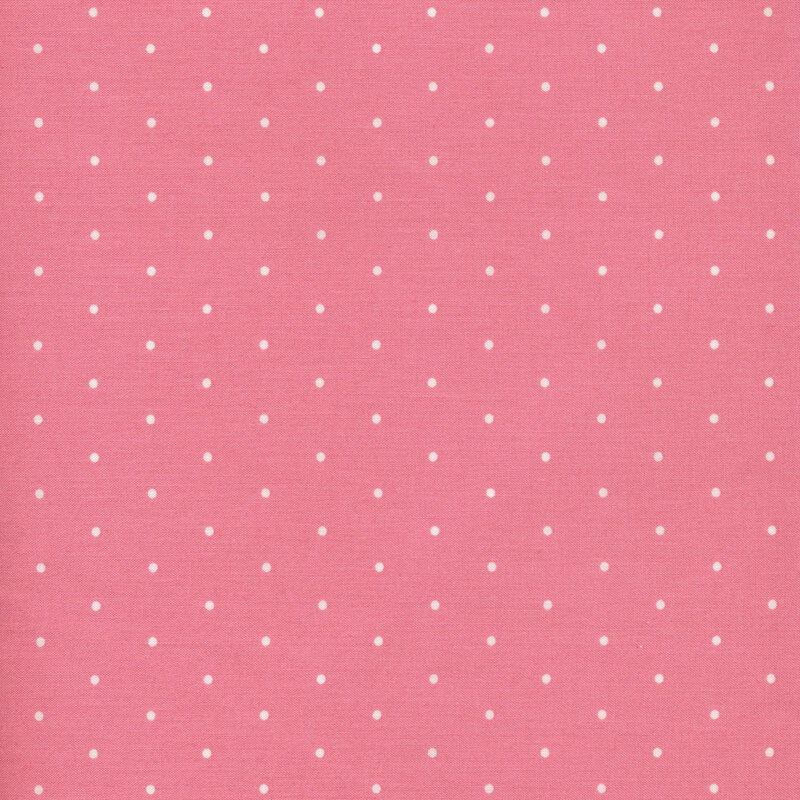 Image of fabric featuring cream polka dots on a pink background