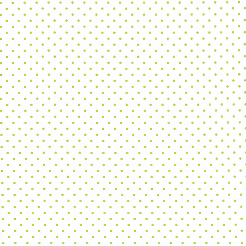 fabric featuring small lime green dots on a white background