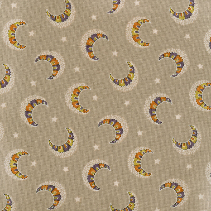 Taupe fabric with scattered crescent moons with orange, yellow, and purple detail with pale tonal accents and stars between them