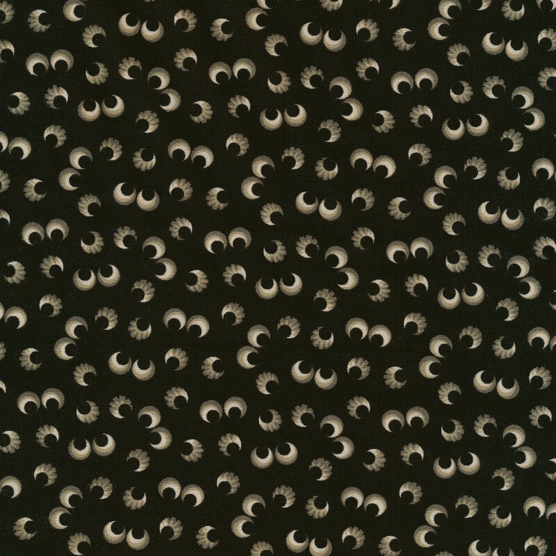 Black fabric with pairs of eyeballs scattered across it