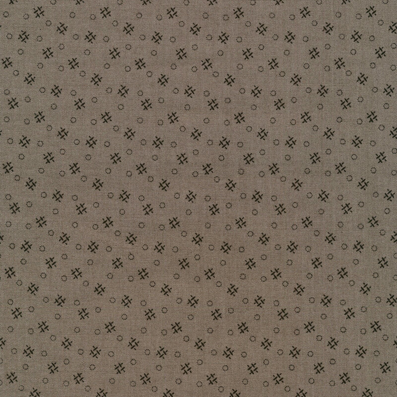 dark taupe fabric with modern geometric patterning that consists of black crosshatches and dotted circles.