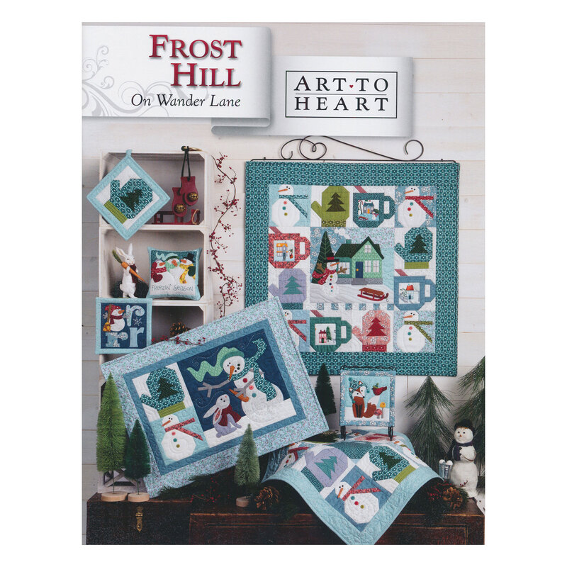Scan of the front of the Frost Hill block pattern book, showing the finished quilt and additional finished projects