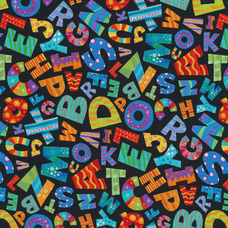 Black sewing fabric with large colorful letters of the alphabet scattered all over
