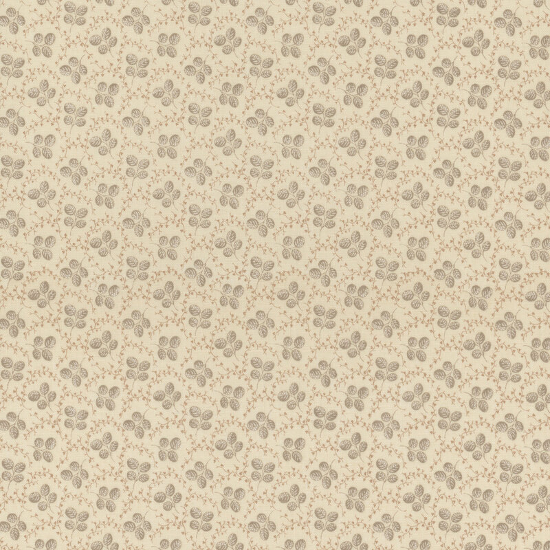 Fabric featuring sprigs of small gray leaves, accented by vines on a cream background