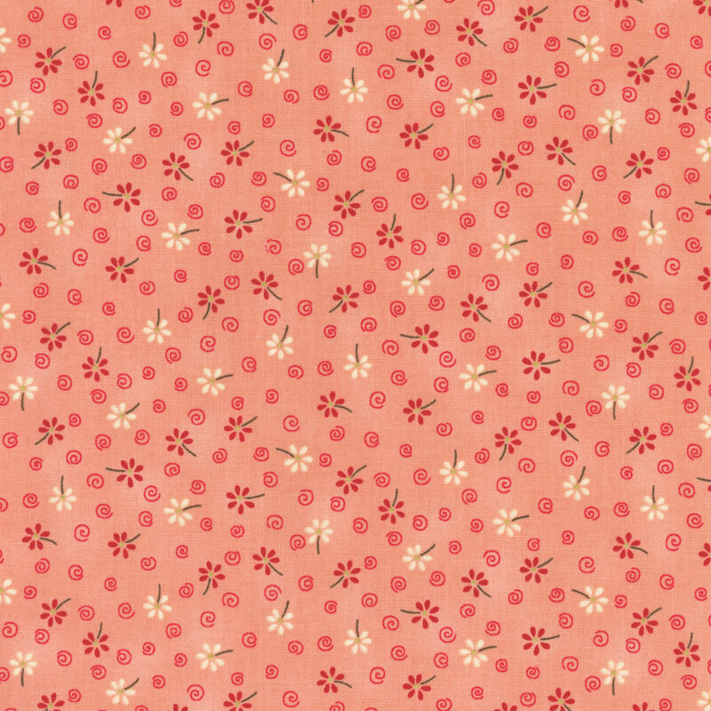 Pink fabric with darker pink and white flowers and pinks swirls across it