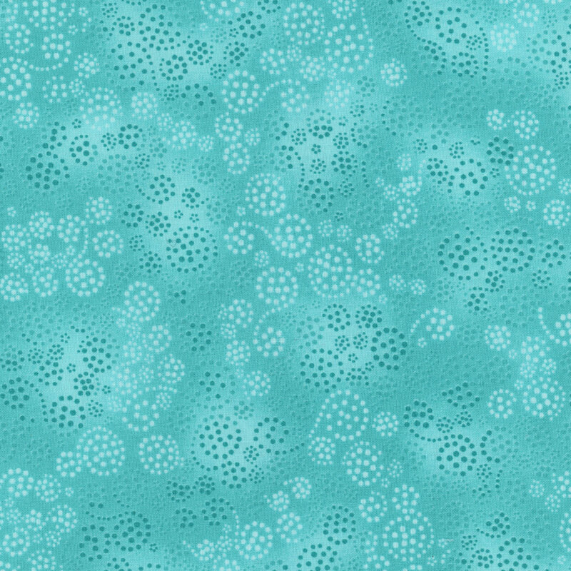 An aqua mottled fabric with light aqua and dark teal dotted swirls all over