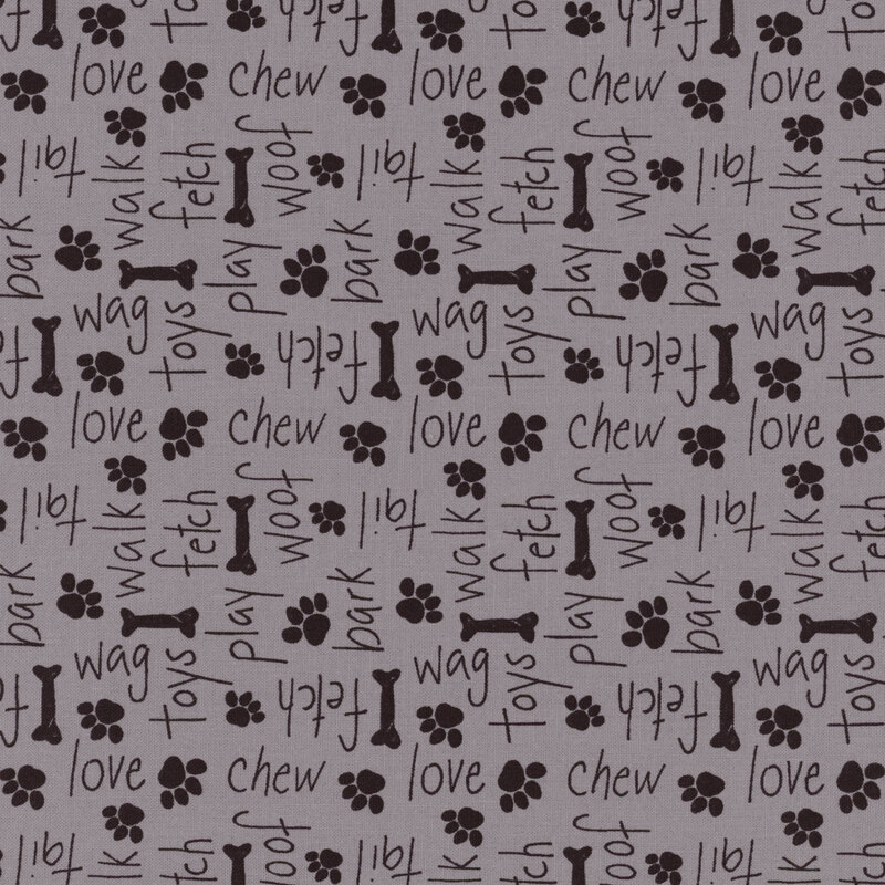 Dark gray fabric with dark tonal paw prints and bones with dog-themed words like 