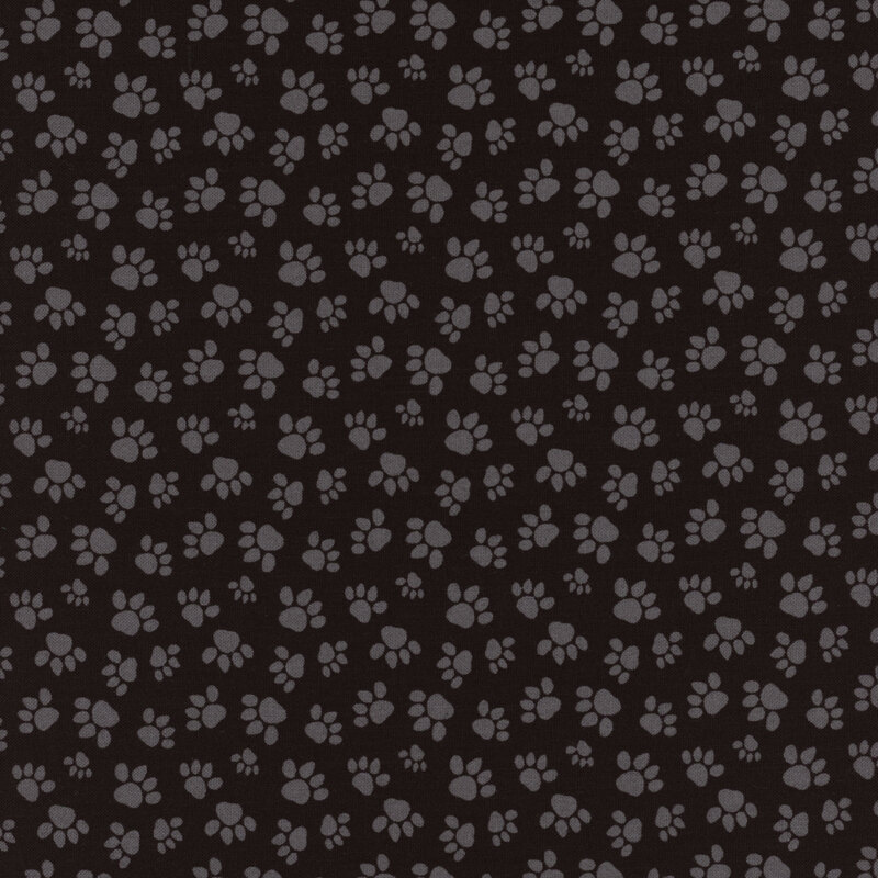 Black fabric with gray tossed paw prints all over
