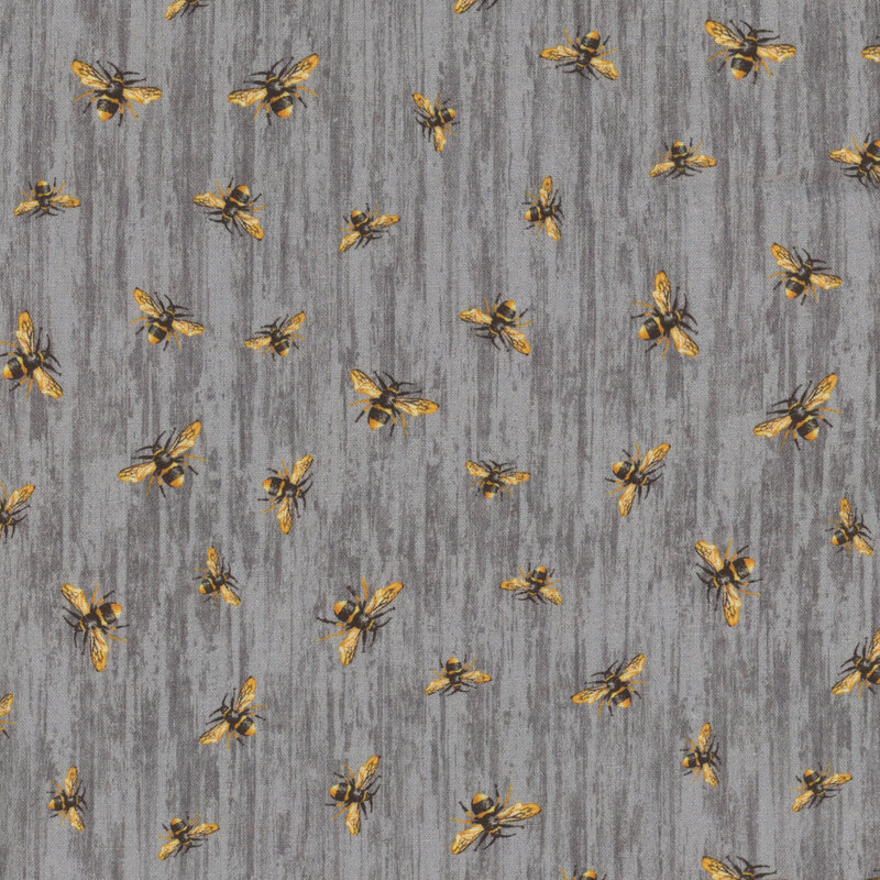 fabric featuring tossed ditsy honey bees on dark gray wood grain 