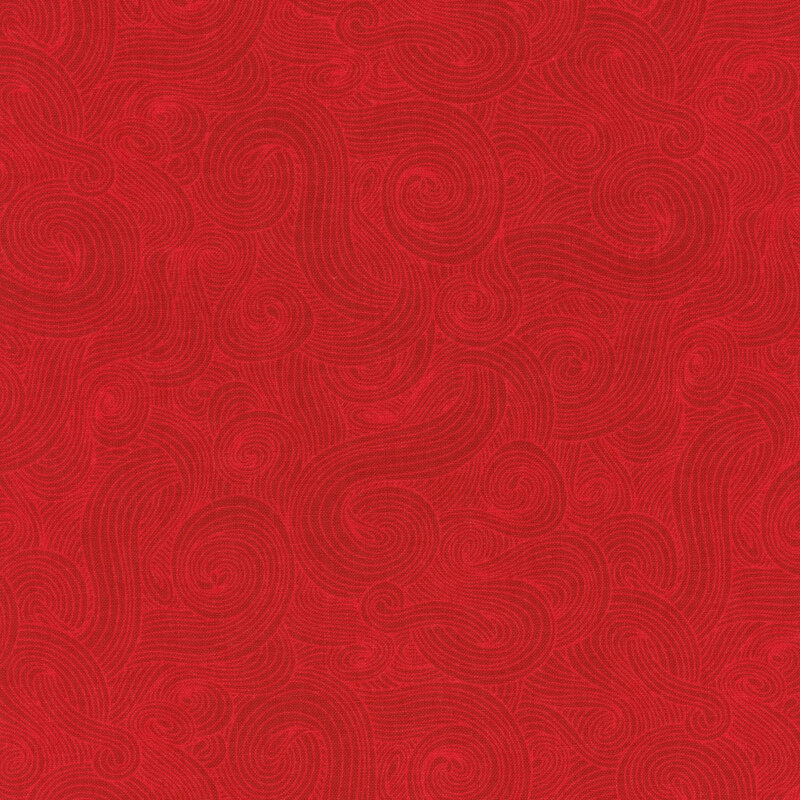 Tonal red fabric with light swirls on a darker background 