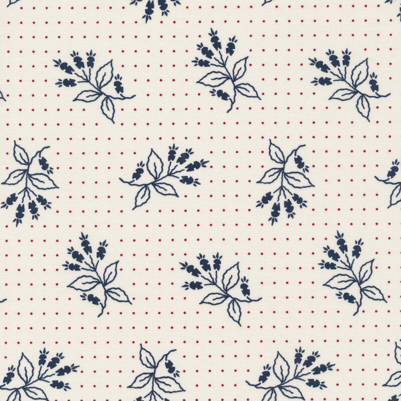 White fabric with small red dots and tossed navy blue floral motifs