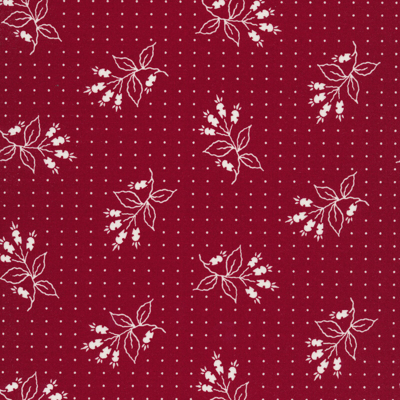 Red fabric with small white dots and tossed white floral motifs 