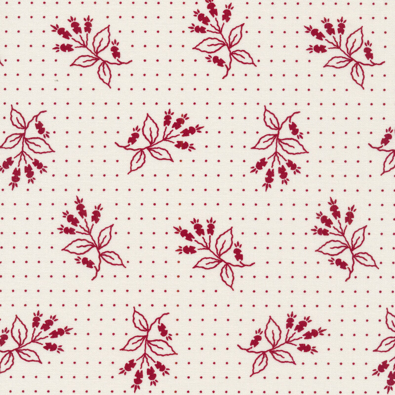 White fabric with small red dots and tossed red floral motifs 