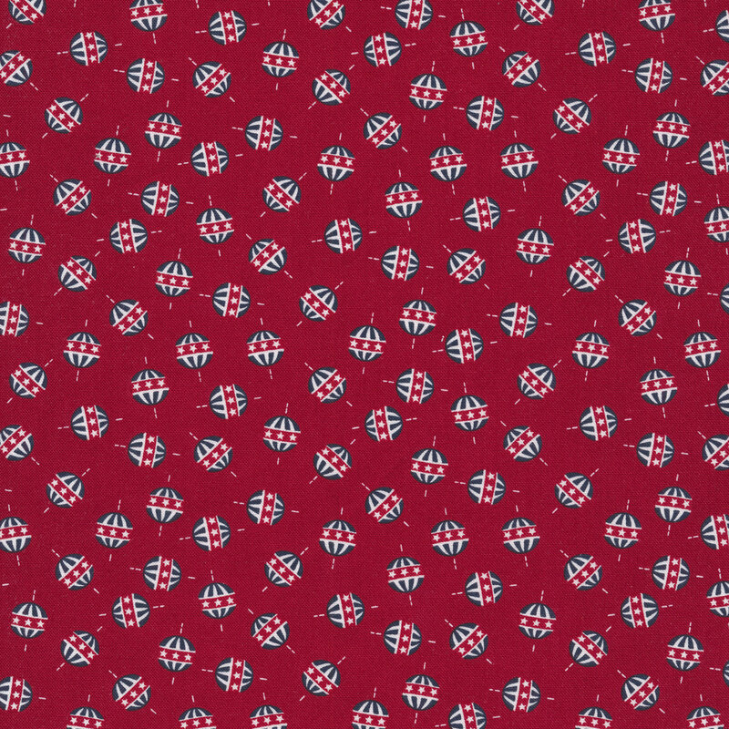 red fabric with red, white and blue globes tossed all over