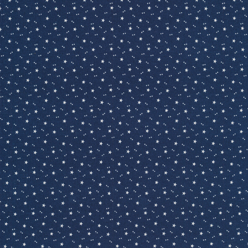 blue patriotic fabric featuring white accents of tiny stars and pairs of dots tossed all over